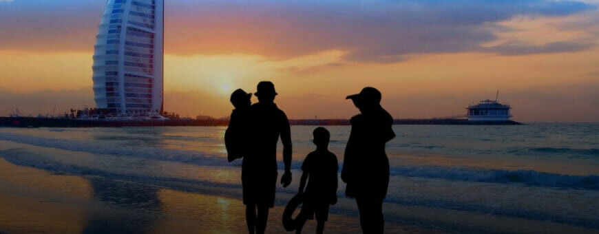 A happy family enjoying their day an the beach in Dubai