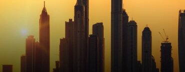 Captivating Dubai skyscrapers standing side by side as the sun sets.